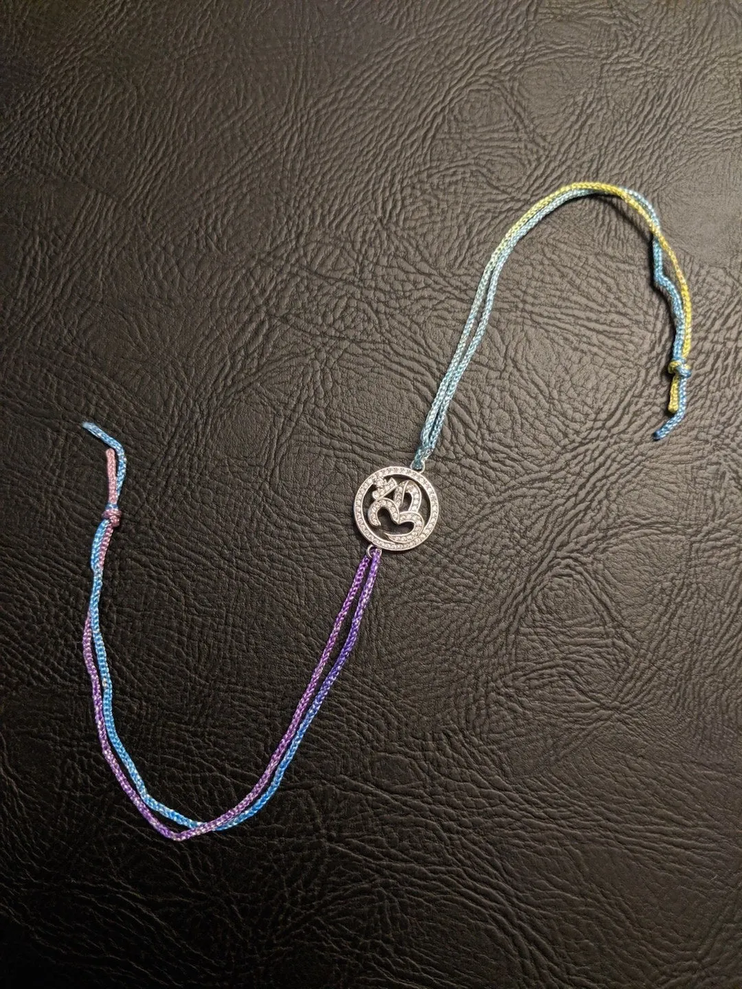 (Combo of 2) American Diamond Om Designs Designer Silver Rakhi & Bracelet For Brother-Bhabhi