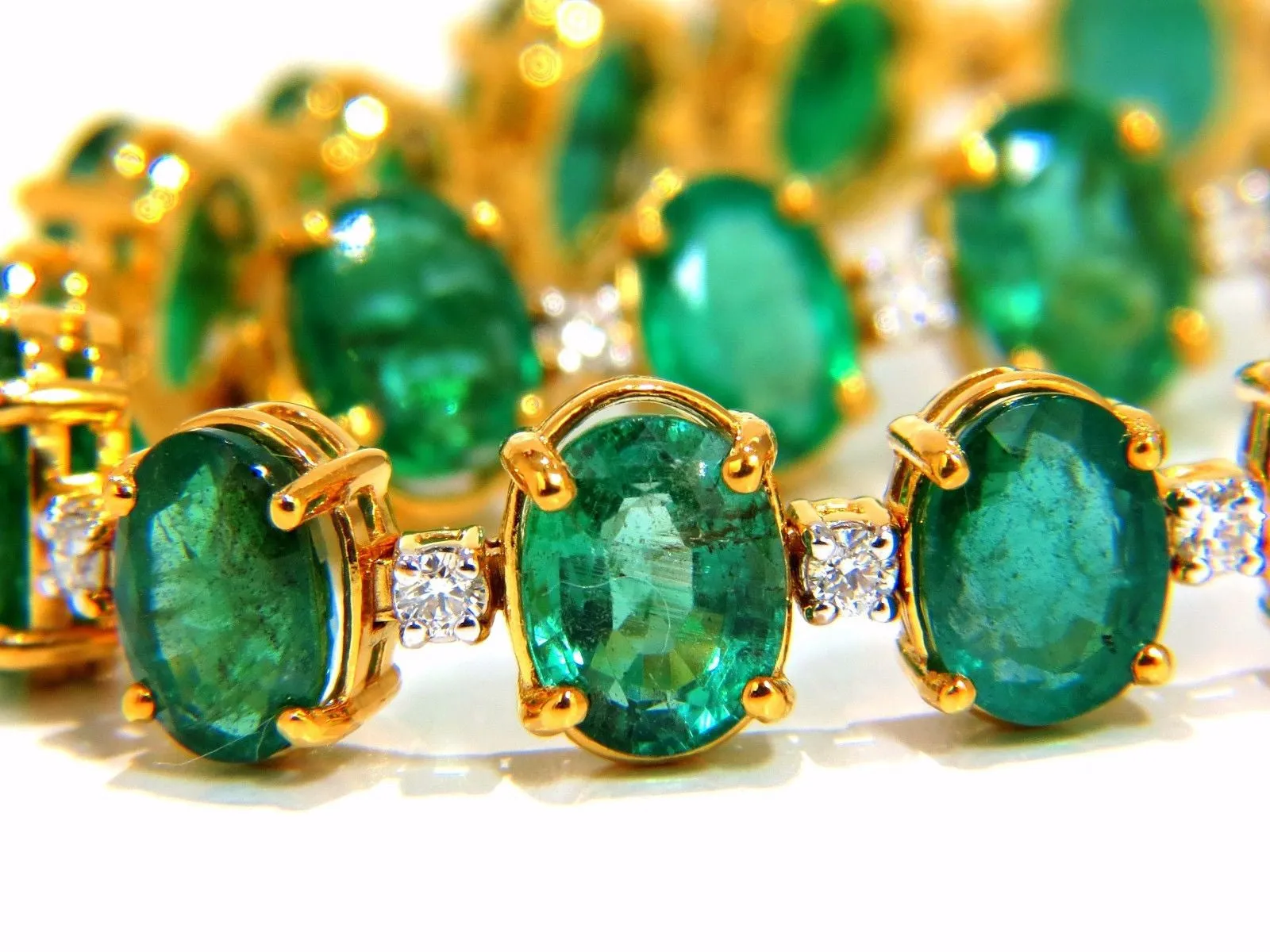 Emerald bracelet 27.42ct & .75ct diamonds classic tennis 14kt. natural greens