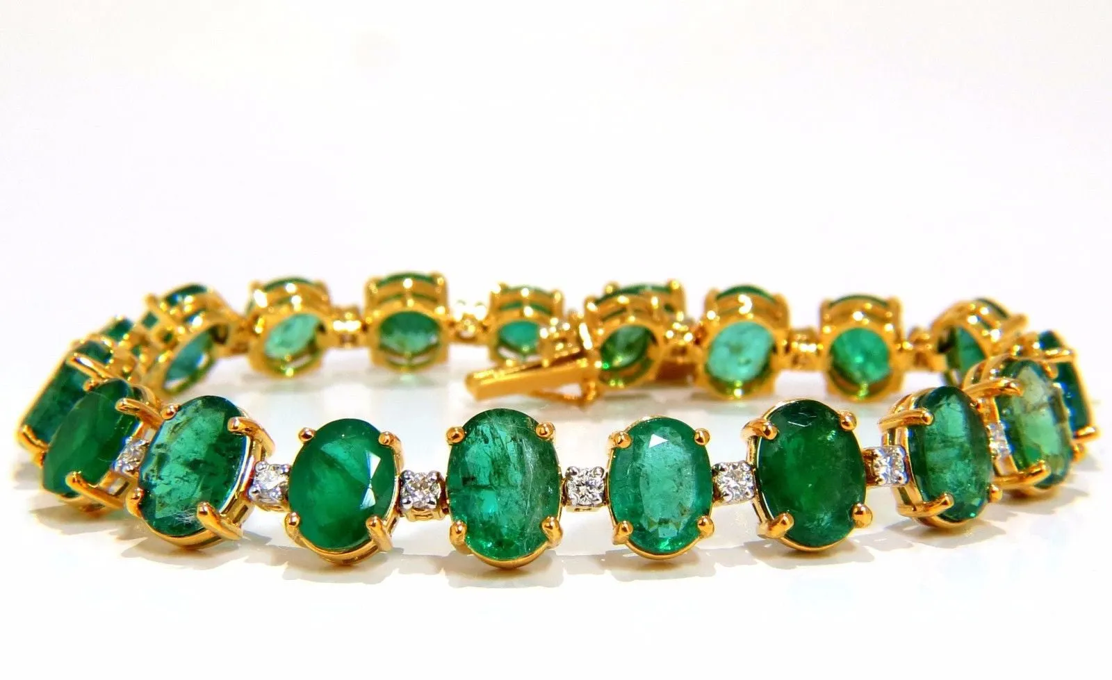 Emerald bracelet 27.42ct & .75ct diamonds classic tennis 14kt. natural greens