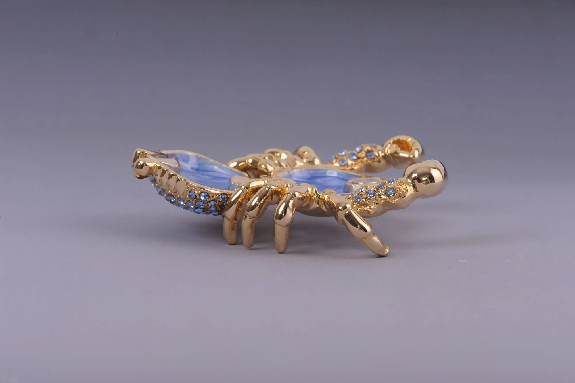 Golden Crab with blue stones