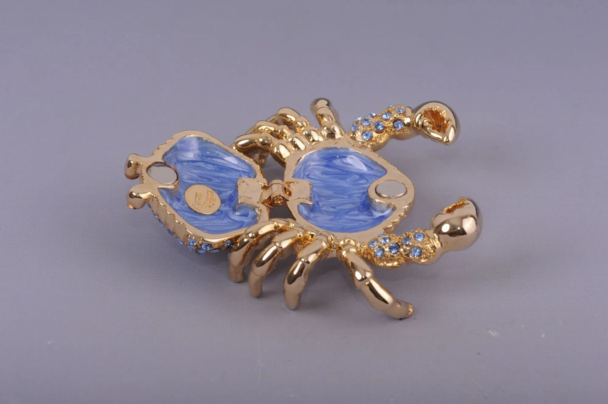 Golden Crab with blue stones