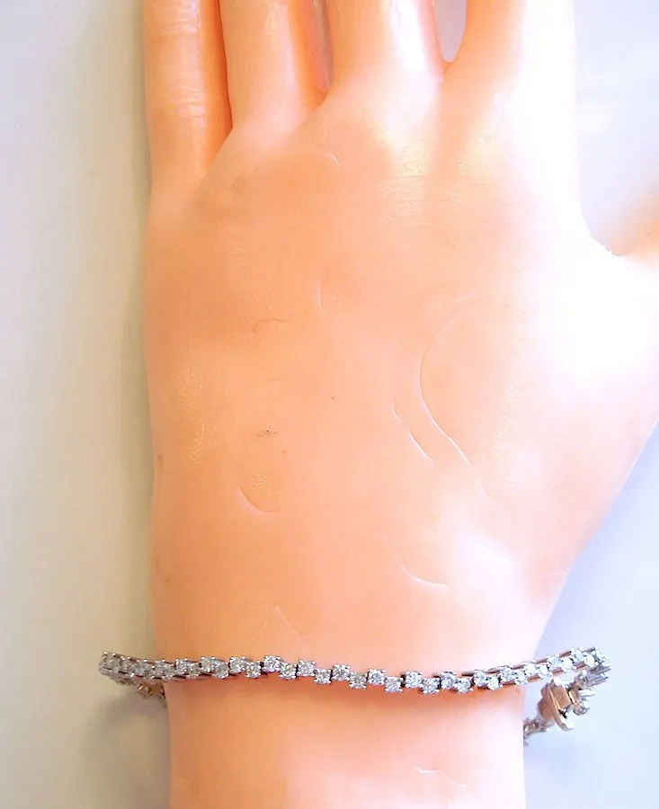 Nearly 2.5 Carats Staggered Diamond Tennis Bracelet in White Gold