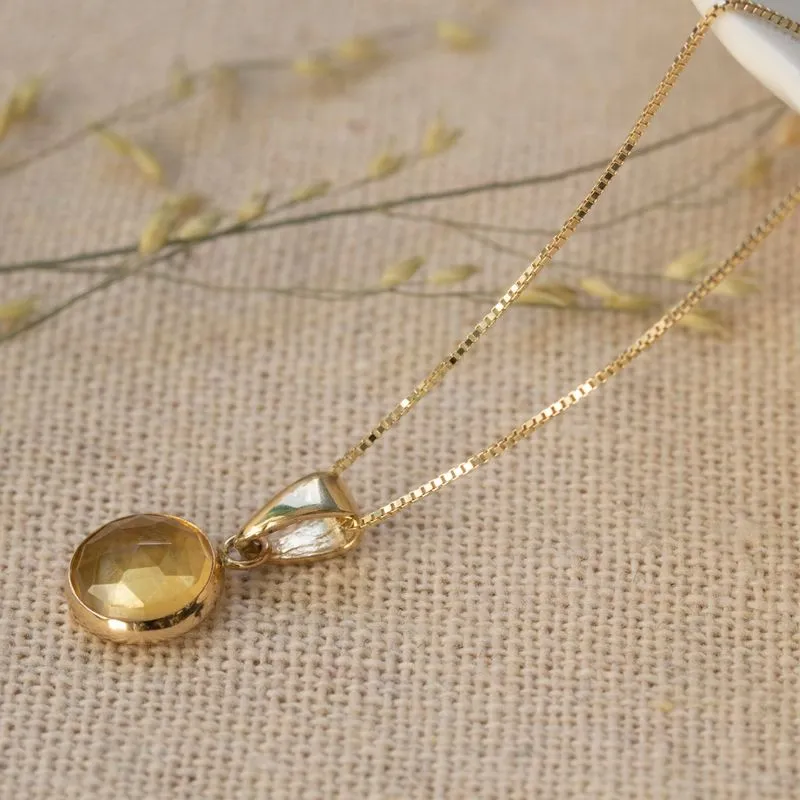 Round yellow gold pendant 8 mm inlaid with citrine stone