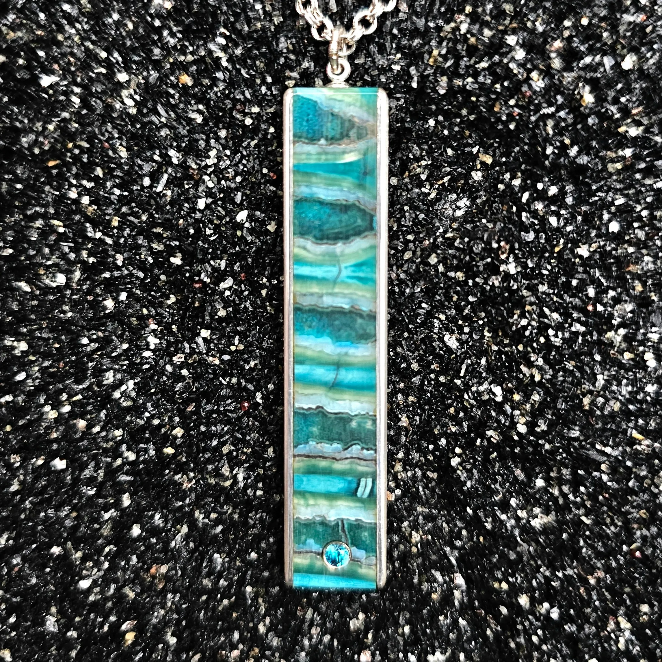 The Fineline Necklace (Fossilized Woolly Mammoth Tooth, Ebony Wood, Silver & Blue Zircon, Set In 14k White Gold)